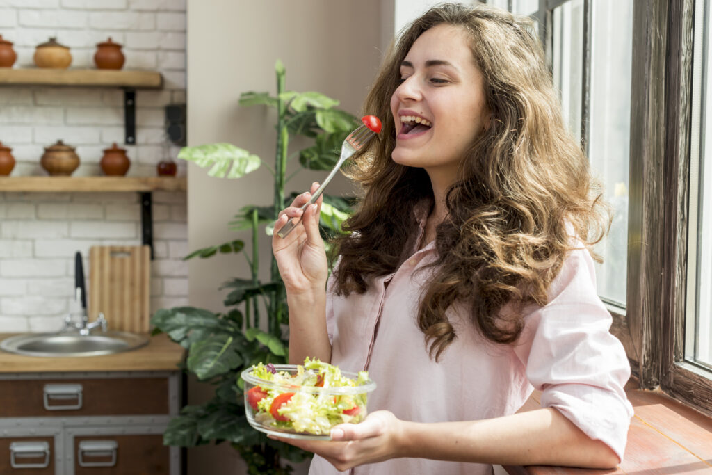 Complete Health and Wellness Guide for Beginners: Start a Healthy Lifestyle Step by Step 5 brunette woman eating salad