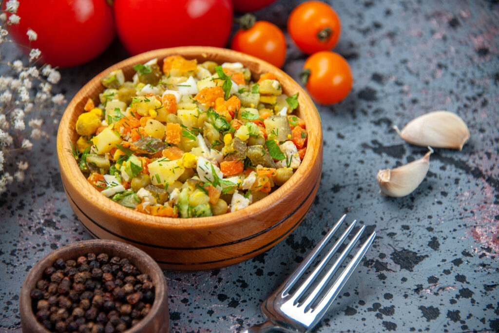 front view boiled vegetable salad with fresh red tomatoes blue background 1