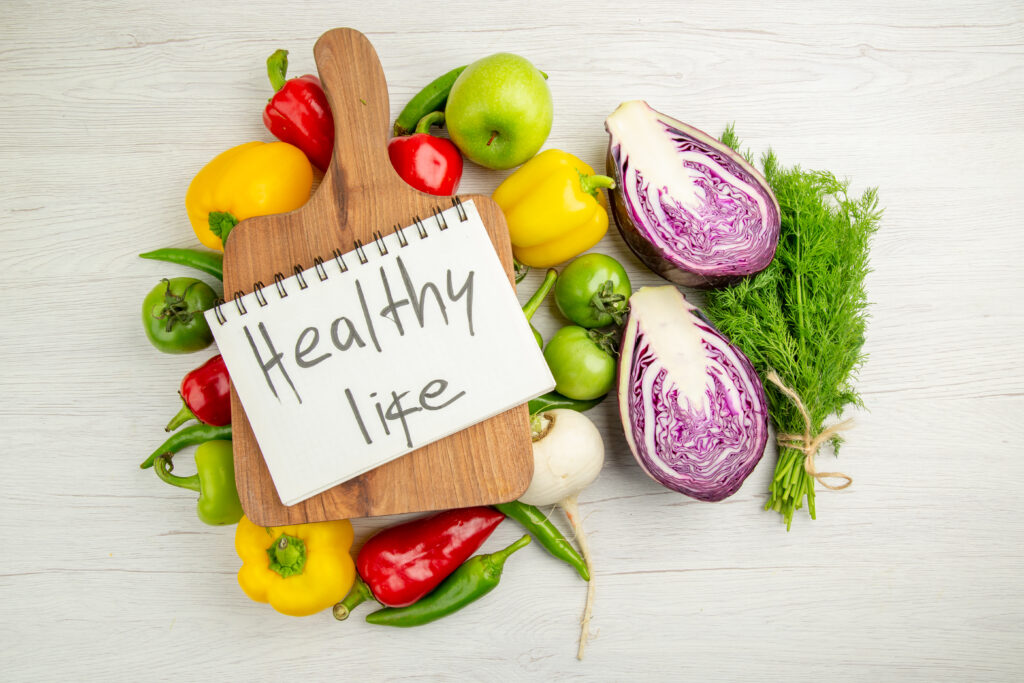 Complete Health and Wellness Guide for Beginners: Start a Healthy Lifestyle Step by Step 2 top view fresh bell peppers with apples red cabbage white background ripe color healthy life diet salad