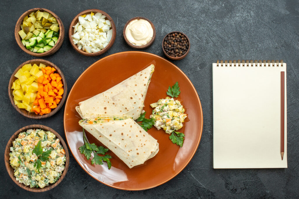 top view sliced shaurma tasty meat sandwich with salad ingredients dark grey surface burger sandwich bread pita meat