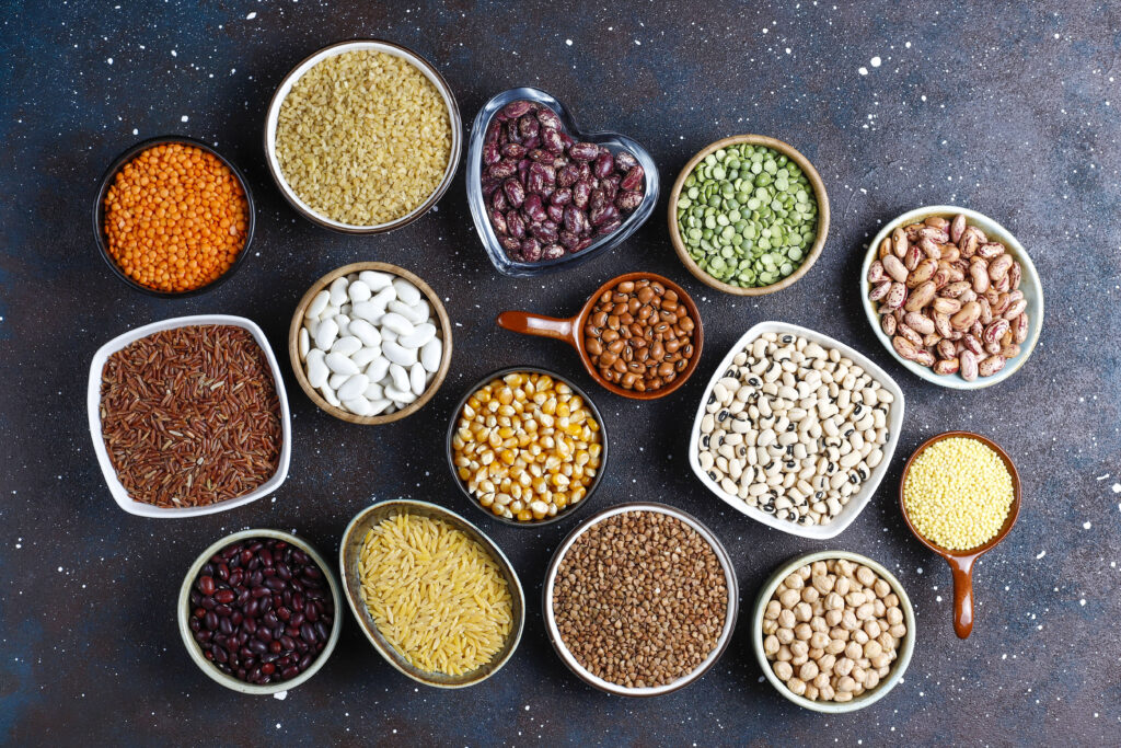 7 Best Foods That Boost Mood Naturally 7 legumes beans assortment different bowls light stone background top view healthy vegan protein food