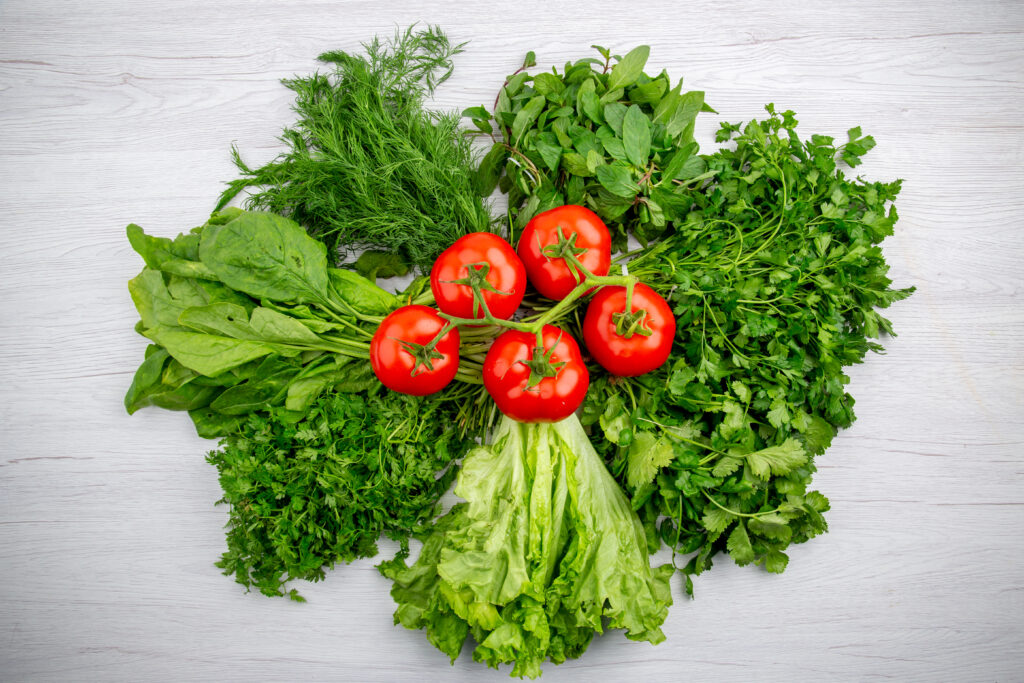 7 Best Foods That Boost Mood Naturally 8 top view bundles fresh greens tomatoes with stem white background