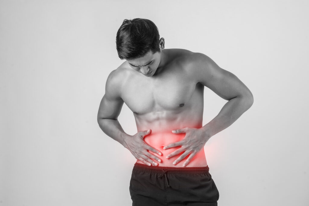 10 Benefits of Drinking Hot Water in the Morning for Better Health 7 young handsome muscular man has abdominal pain isolated white background